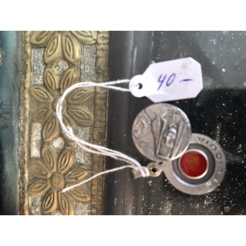 Saint Marie Louise Trichet original relic in a medallion that opens up showing a piece of clothing with her blood