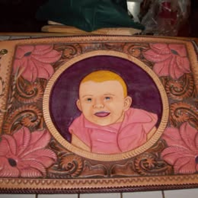 This is a hand carved leather photo album made by serial killer Edward Wayne Edwards in 1957